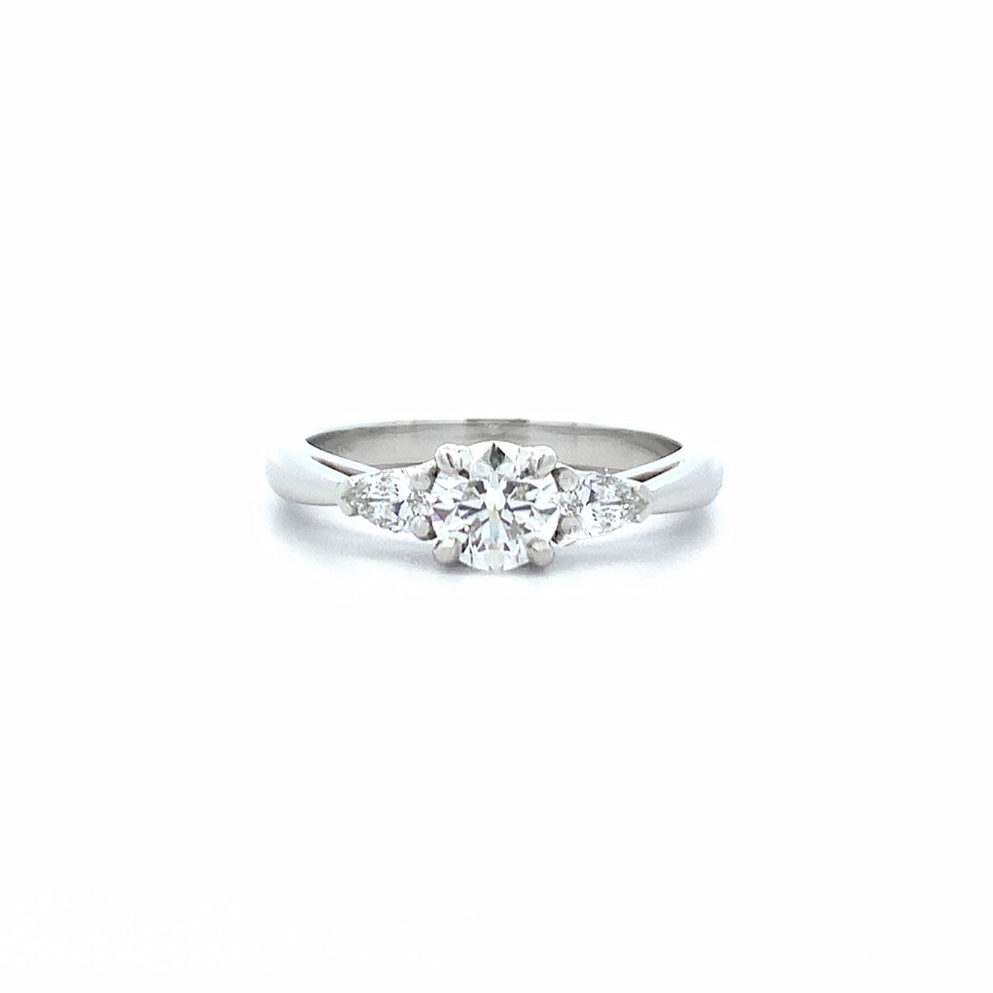 Reflect: Brilliant Cut Diamond Three Stone Ring in Platinum