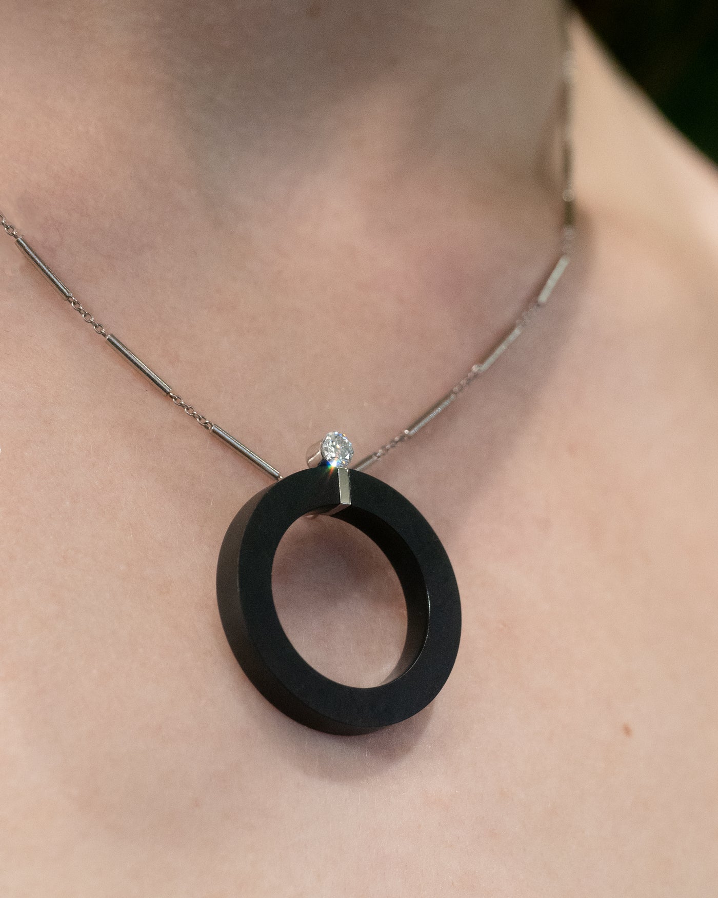 Exclamation: Floeting® Diamond and Black Jade Circle Pendant in Platinum | 0.26ct