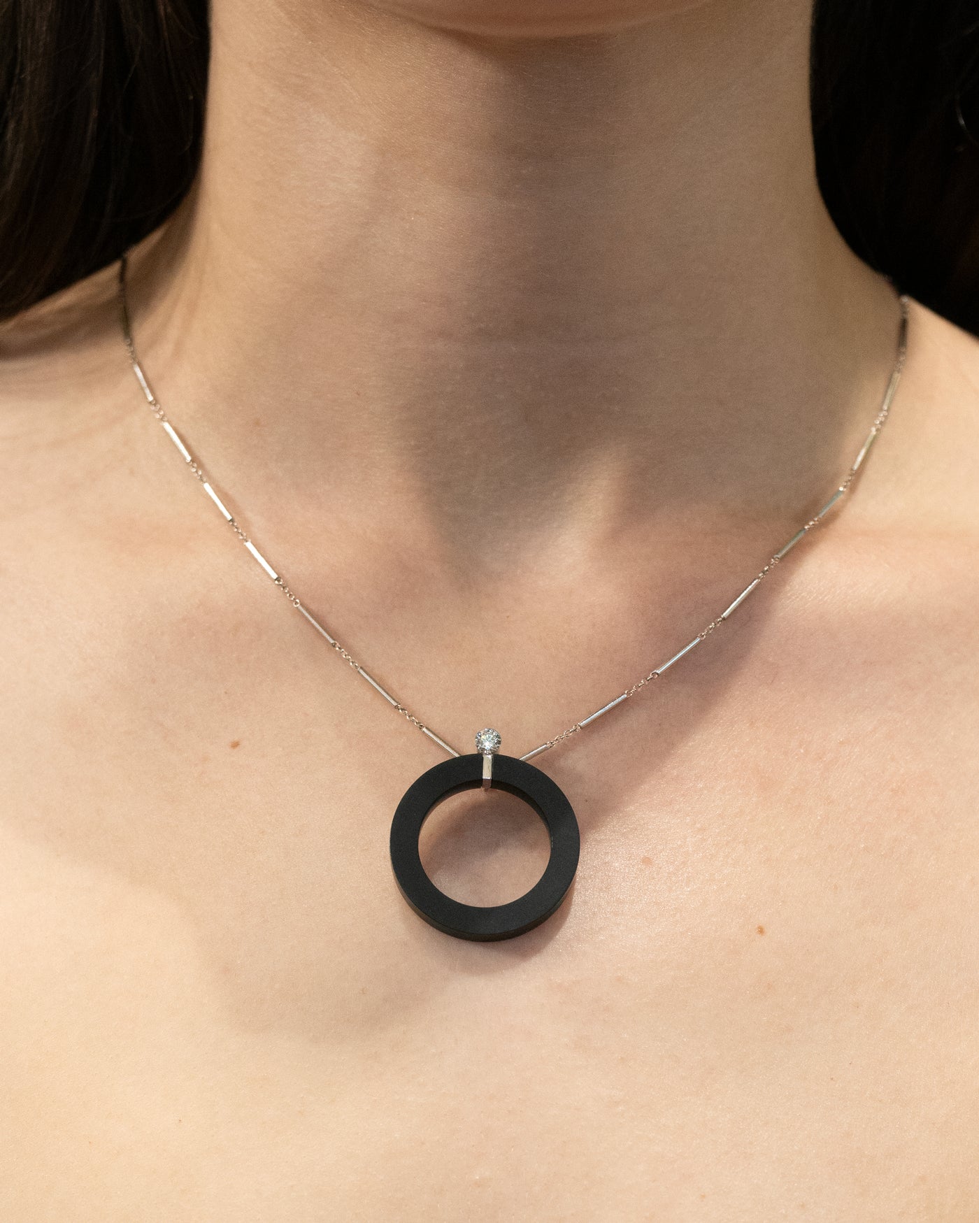 Exclamation: Floeting® Diamond and Black Jade Circle Pendant in Platinum | 0.26ct