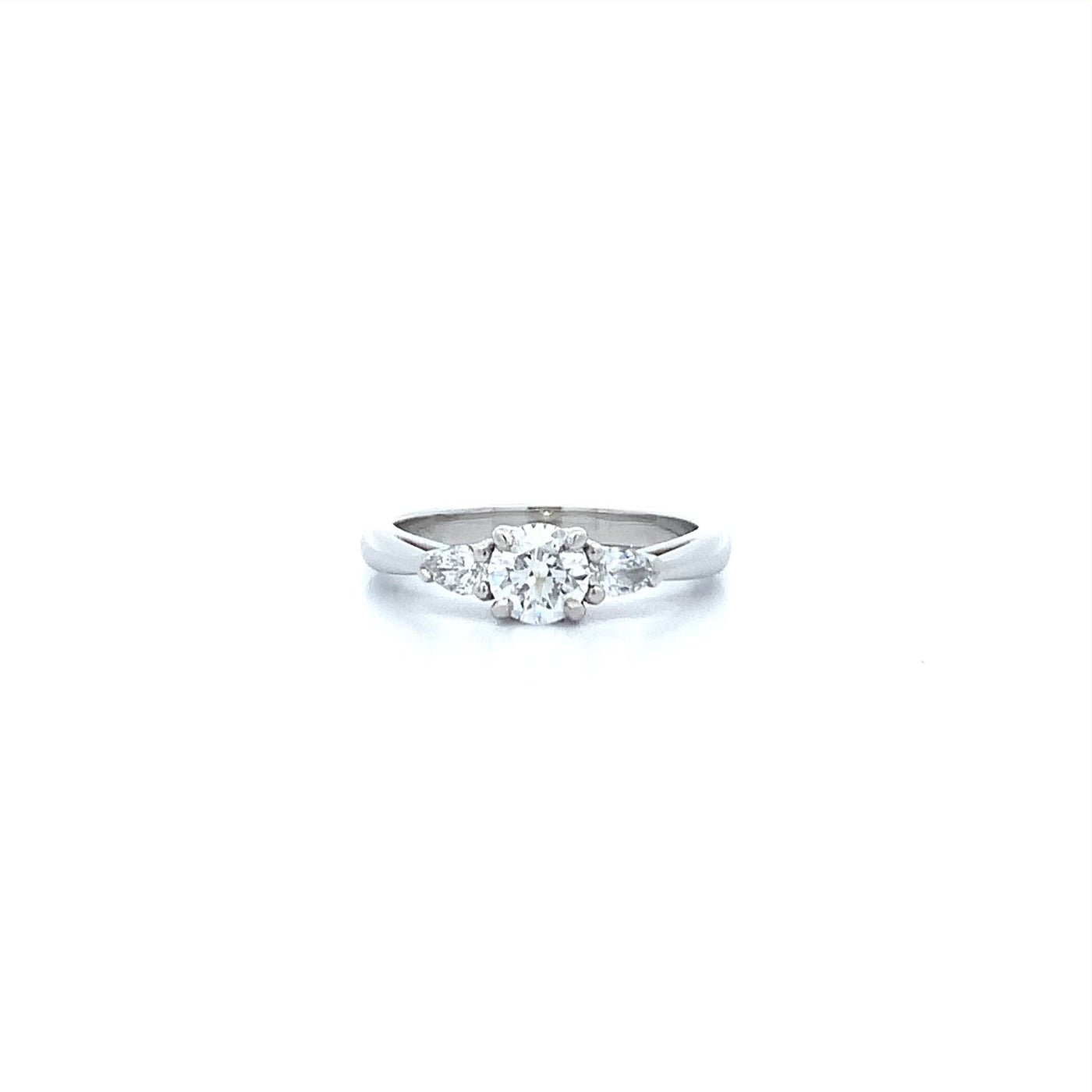 Reflect: Brilliant Cut Diamond Three Stone Ring in Platinum